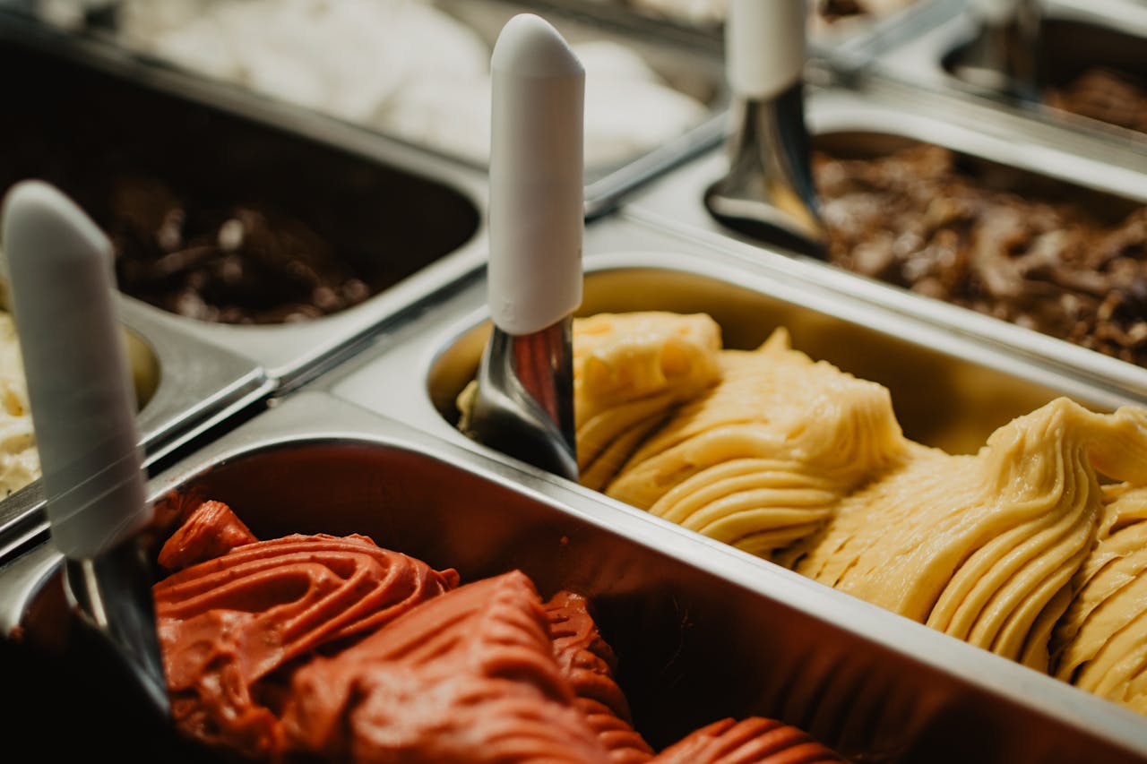 Mastering the First Impression: Your intriguing post title goes here A vibrant display of colorful gelato flavors in metal trays at an ice cream shop.
