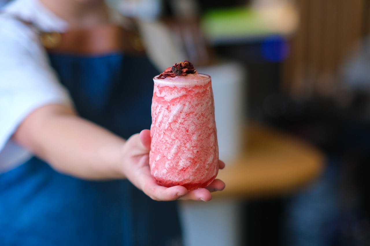 Close-up of a delicious strawberry smoothie served in a colorful glass, perfect for a refreshing treat.